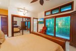 Enjoy a small, private lanai with garden views off of the bedroom